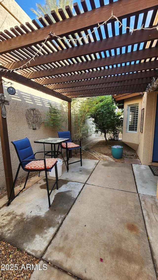 view of patio featuring a pergola