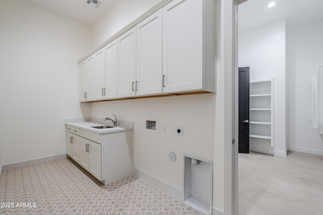 laundry area with hookup for an electric dryer, cabinet space, hookup for a washing machine, light flooring, and baseboards