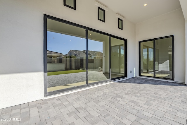 view of patio featuring fence
