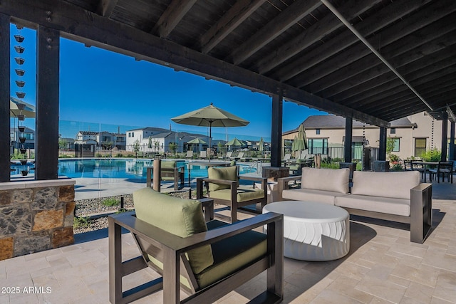 view of patio / terrace with a community pool and outdoor lounge area