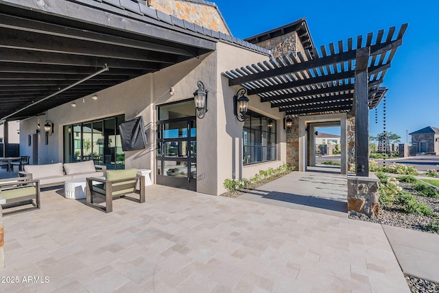 view of patio featuring outdoor lounge area and a pergola