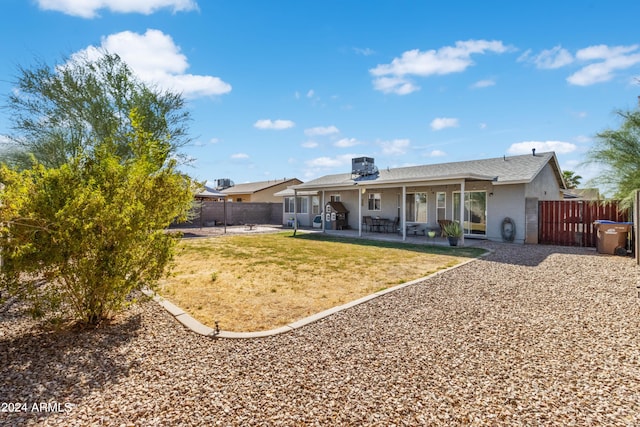 back of house with a patio area