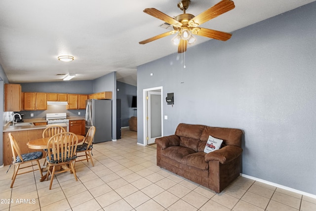 interior space with vaulted ceiling, ceiling fan, and sink