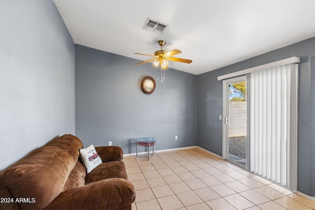 tiled living room featuring ceiling fan