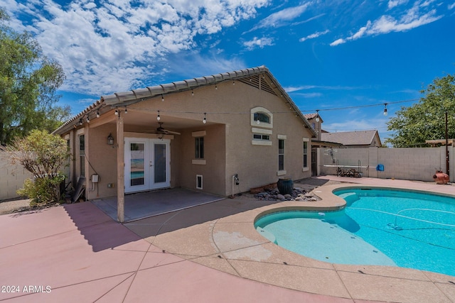 view of pool featuring french doors, ceiling fan, and a patio