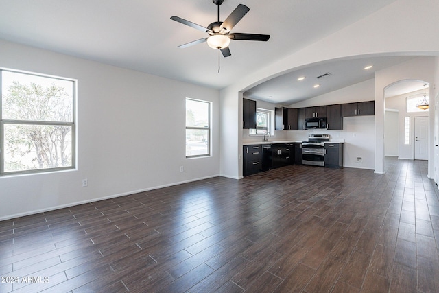 unfurnished living room featuring vaulted ceiling, dark wood-type flooring, sink, and ceiling fan