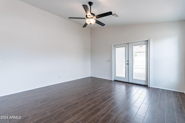 unfurnished room with dark wood-type flooring, ceiling fan, lofted ceiling, and french doors