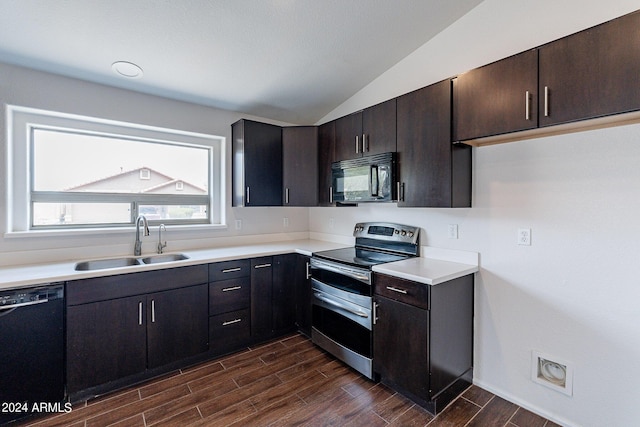 kitchen featuring lofted ceiling, sink, dark brown cabinets, and black appliances