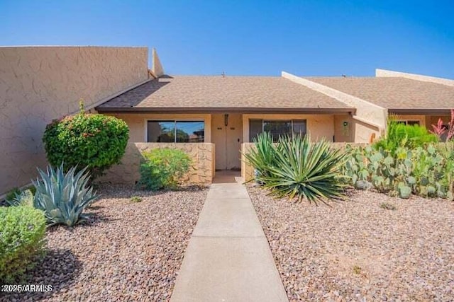 view of front of home featuring stucco siding
