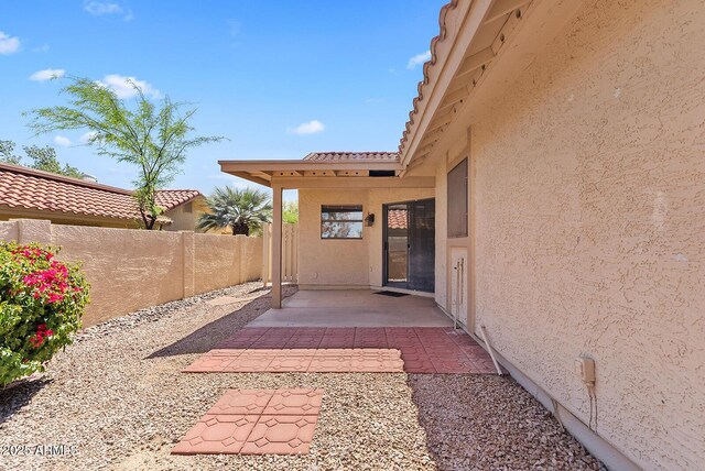 view of patio featuring fence