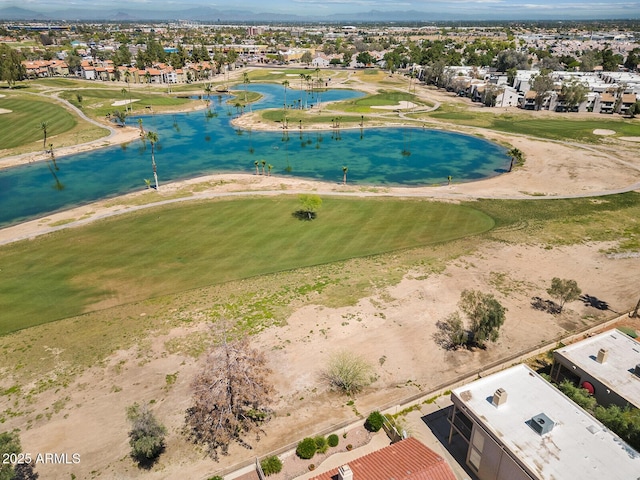 birds eye view of property featuring view of golf course, a water view, and a residential view