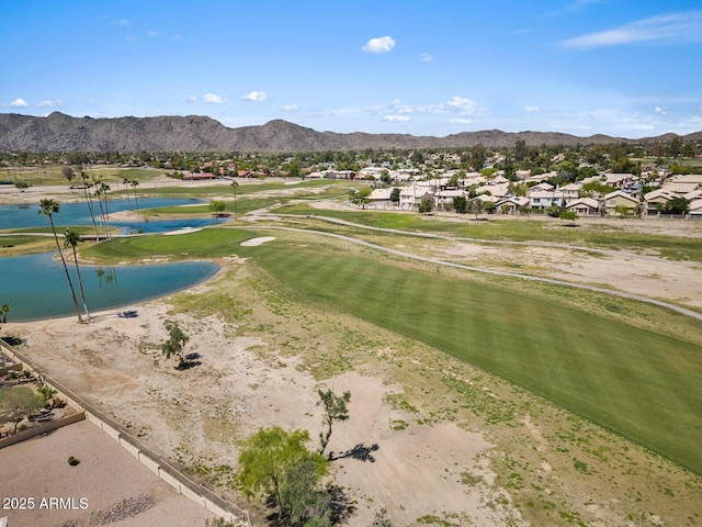 surrounding community with a residential view, view of golf course, and a water and mountain view