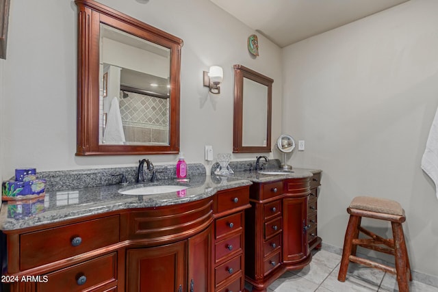 bathroom with tile patterned floors and vanity