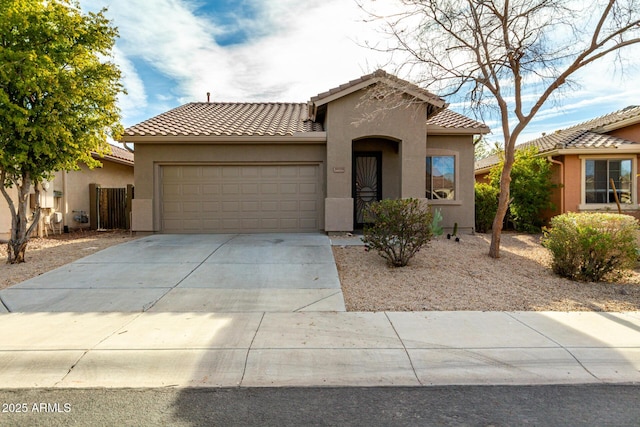 mediterranean / spanish-style house featuring a garage