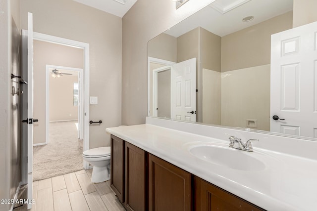 bathroom with vanity and toilet