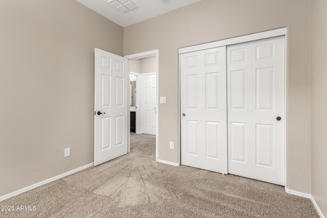 unfurnished bedroom with carpet and a closet