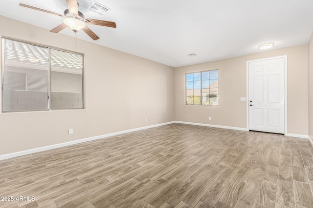 unfurnished room featuring light hardwood / wood-style floors and ceiling fan