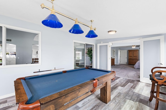 recreation room featuring wood finished floors, billiards, ceiling fan, and baseboards