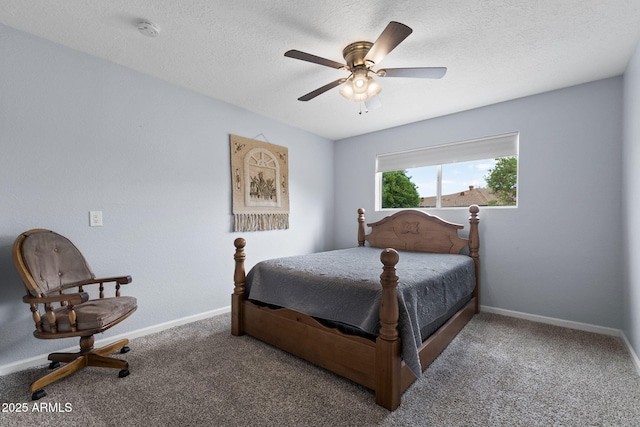 bedroom featuring carpet floors, baseboards, a ceiling fan, and a textured ceiling