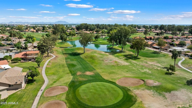 aerial perspective of suburban area featuring a water and mountain view and a golf course
