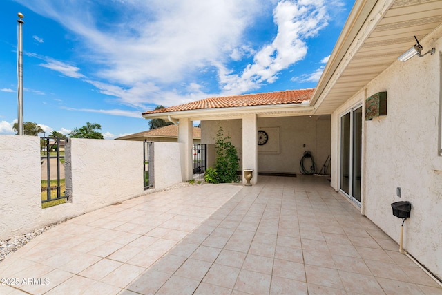 view of patio / terrace featuring a gate