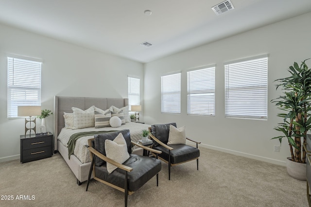 bedroom featuring light carpet, baseboards, and visible vents