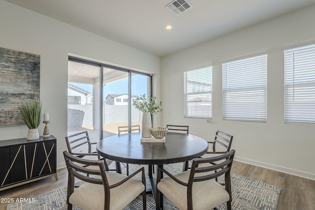 dining area with recessed lighting, visible vents, baseboards, and wood finished floors