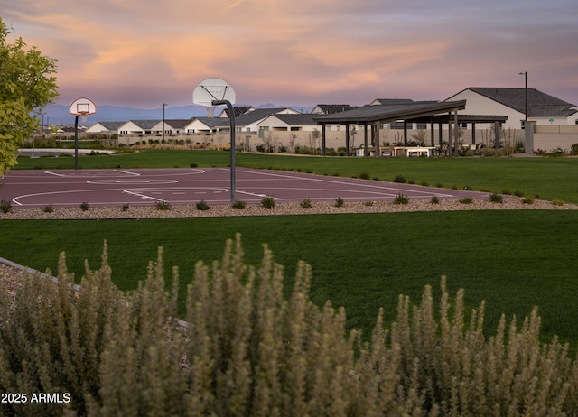 view of sport court featuring community basketball court, a lawn, a gazebo, and fence