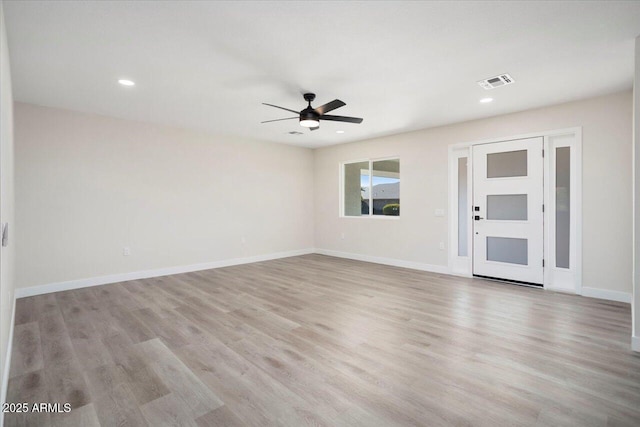 unfurnished room featuring ceiling fan and light wood-type flooring