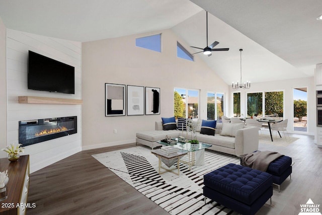 living room featuring a healthy amount of sunlight, wood-type flooring, and a fireplace