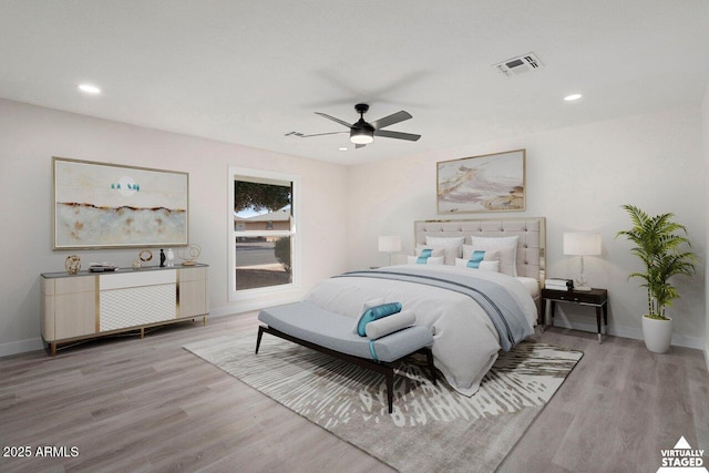 bedroom featuring ceiling fan and light hardwood / wood-style flooring