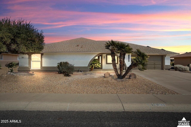 ranch-style home with a garage