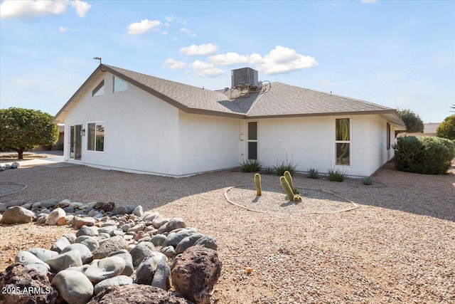 back of house featuring central AC