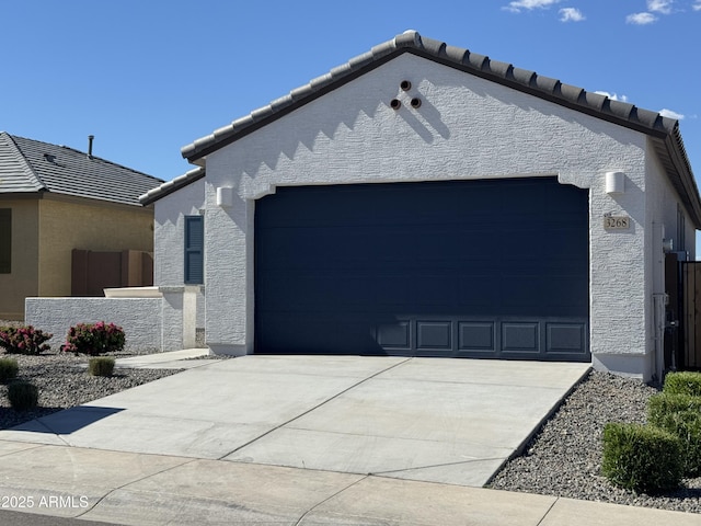 3268 W Caleb Rd, Phoenix, AZ 85083 - view of side of home with a tile roof, a garage, concrete driveway, and stucco siding