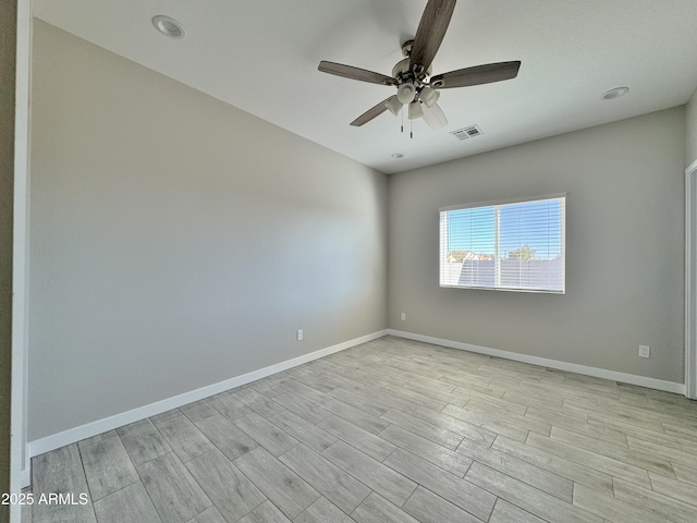 unfurnished room with ceiling fan