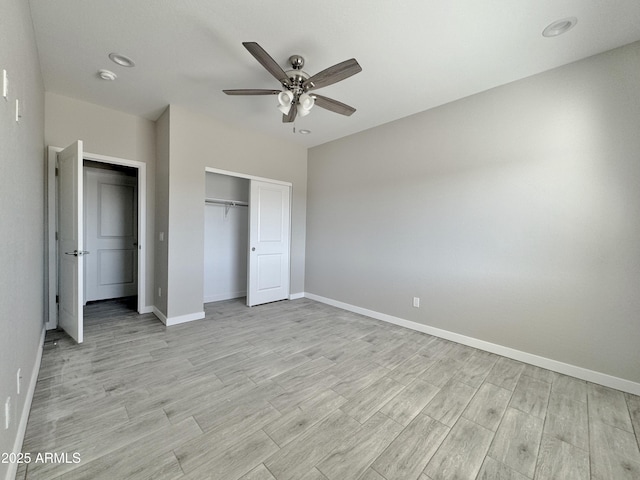 unfurnished bedroom with ceiling fan and a closet