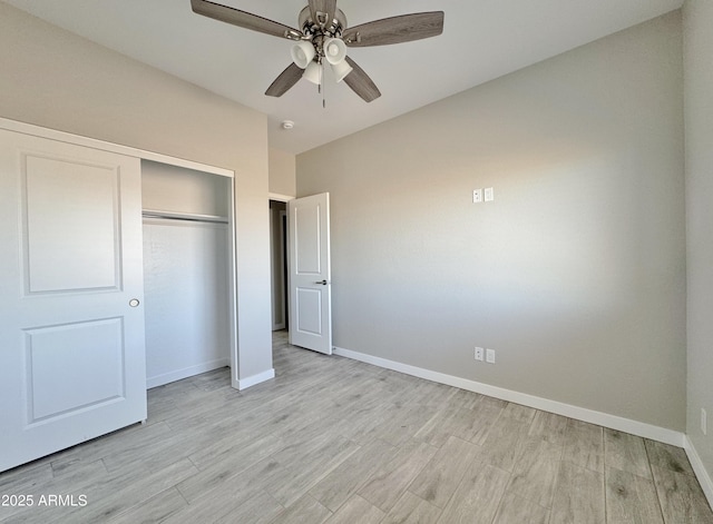 unfurnished bedroom featuring ceiling fan, a closet, and light hardwood / wood-style floors