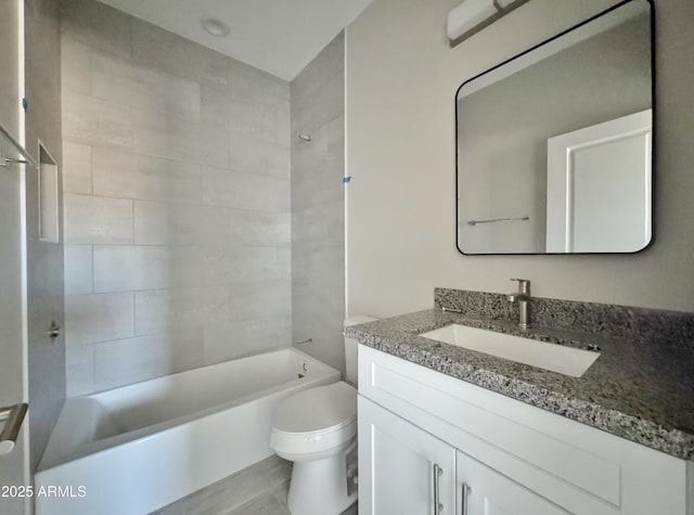 full bathroom featuring vanity, tiled shower / bath combo, and toilet