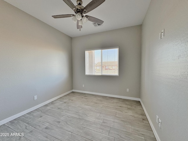 spare room with ceiling fan