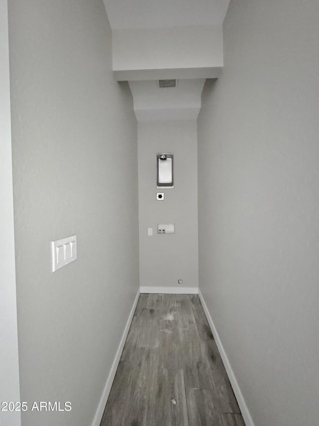 laundry area with hardwood / wood-style flooring