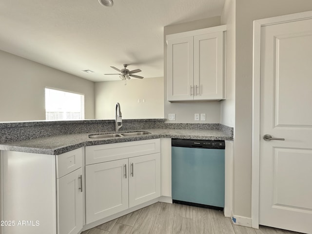 kitchen featuring sink, light hardwood / wood-style flooring, stainless steel dishwasher, ceiling fan, and white cabinetry