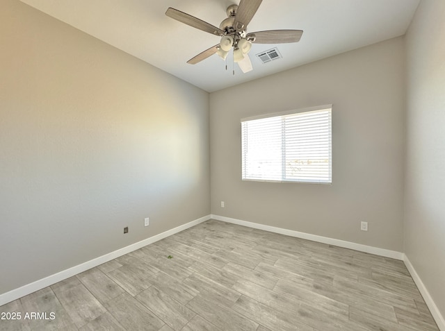 unfurnished room featuring ceiling fan and light wood-type flooring