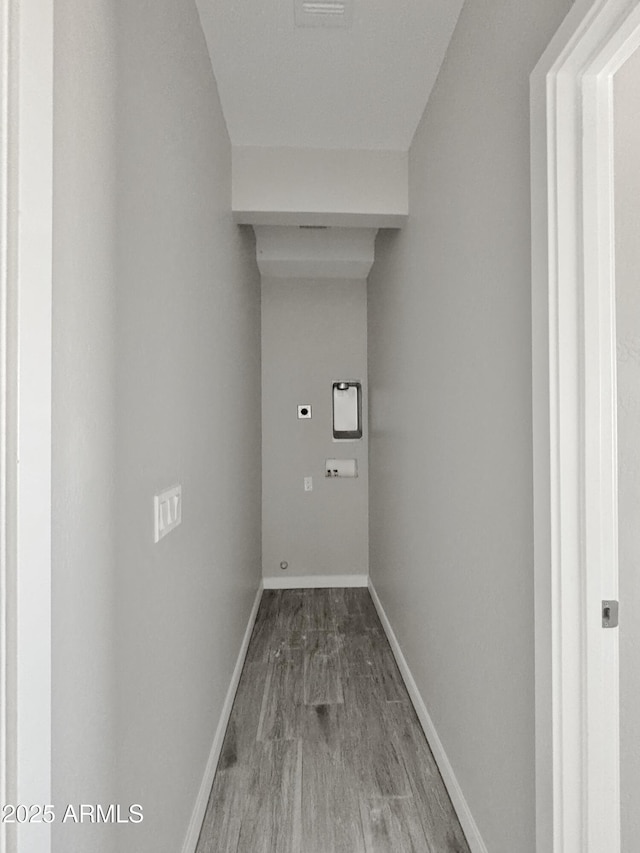 laundry room with washer hookup, hardwood / wood-style flooring, and electric dryer hookup