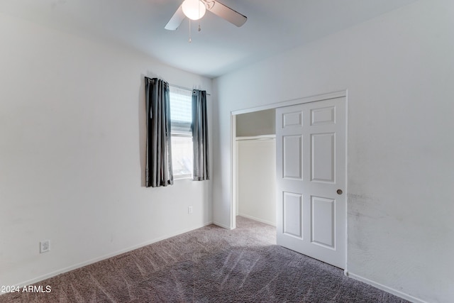 unfurnished bedroom featuring carpet flooring, ceiling fan, and a closet