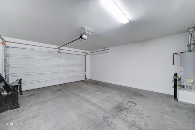 garage featuring a garage door opener and water heater