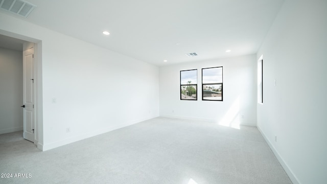 empty room with light colored carpet