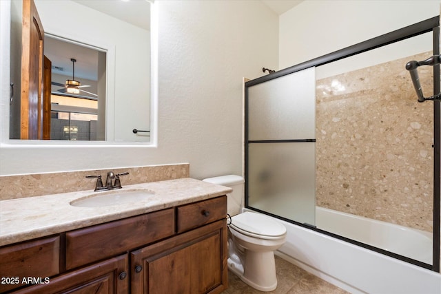 bathroom featuring shower / bath combination with glass door, vanity, and toilet