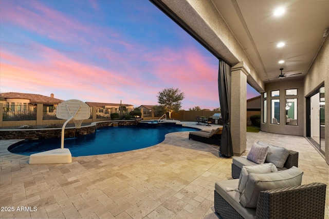 view of pool with a patio, a fenced in pool, a fenced backyard, and an in ground hot tub