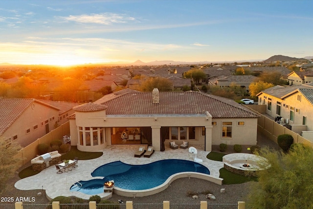 view of swimming pool with a fenced in pool, a patio, an outdoor living space with a fire pit, and a fenced backyard