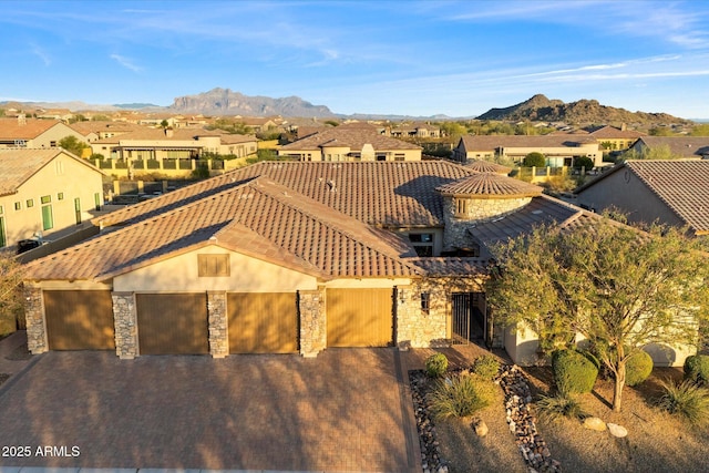 aerial view featuring a mountain view and a residential view